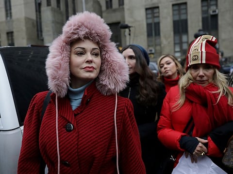 FILE PHOTO: Rose McGowan arrives with Rosanna Arquette to speak to reporters outside New York Criminal Court on the first day of film producer Harvey Weinstein's sexual assault trial in the Manhattan borough of New York City, New York, U.S., January 6, 2020. REUTERS/Jeenah Moon/File Photo