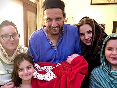 Shahid Afridi poses with his family and new addition