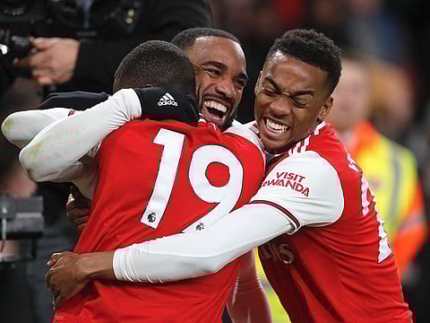 Arsenal's Alexandre Lacazette, centre, celebrates after scoring his side's fourth goal against Newcastle