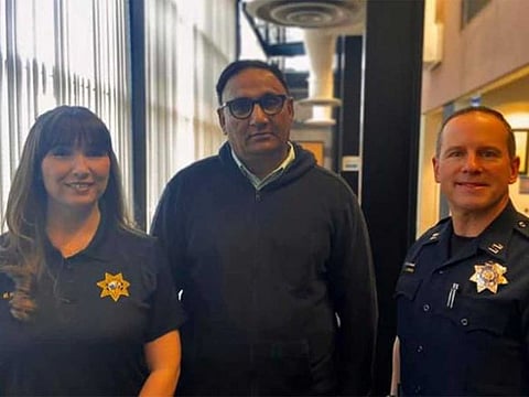 Rajbir Singh saved an elderly passenger in his cab from giving a scammer $25,000 in Roseville, California. He is flanked by Roseville Police records clerk Megan Harrigan and police Capt. Josh Simon.