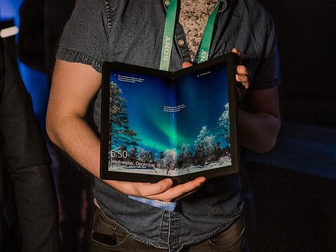 Lenovo’s ThinkPad X1 Fold tablet at the Consumer Electronics Show in Las Vegas on Jan. 7, 2020. Paying for gas with Amazon’s Alexa or playing table tennis with a robot: Whether the latest tech trends will become fixtures in our lives is an open question. (Alex Welsh/The New York Times)