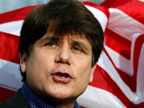 Former Illinois Governor Rod Blagojevich makes a statement to reporters outside his Chicago home one day before reporting to federal prison in Colorado to serve a 14-year sentence for corruption on March 14, 2012.