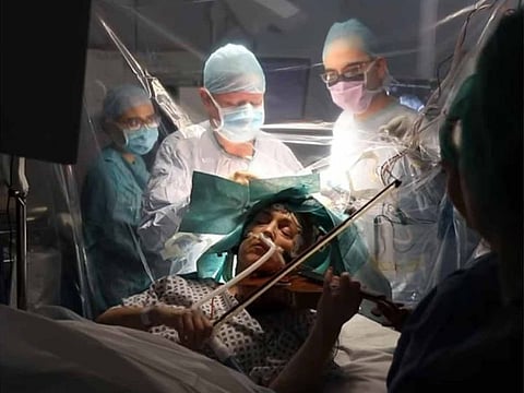 Screengrab from a video showing Dagmar Turner playing violin during brain surgery