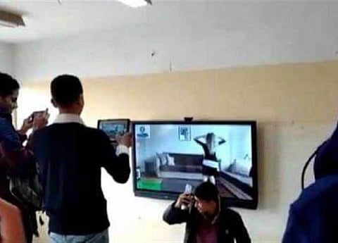 A screen shot from a video purportedly showing students at an Egyptian school seeing a belly dance clip at the classroom.