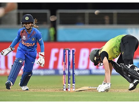 Australia's Ellyse Perry is bowled on her first ball by India's Poonam Yadav during the opening match of the women's Twenty20 World Cup at the Sydney Showground