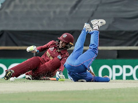 Shemaine Campbelle of the West Indies (L) collides with Wongpaka Liengprasert of Thailand during the women's Twenty20 World Cup cricket match in Perth 