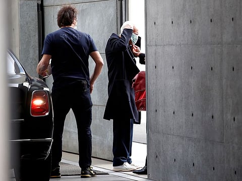 Designer Giorgio Armani puts on a face mask as he arrives at the venue of his Autumn/Winter 2020 collection fashion show during Milan Fashion Week in Milan, Italy, February 23, 2020.