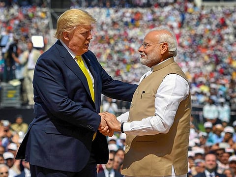 Prime Minister Narendra Modi shakes hands with US President Donald Trump during the 'Namaste Trump' event at Sardar Patel Stadium in Ahmedabad on Monday.