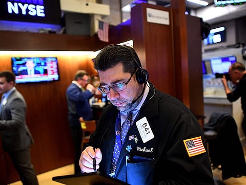 Traders work during the closing bell at the New York Stock Exchange (NYSE) on February 24, 2020 at Wall Street in New York City.