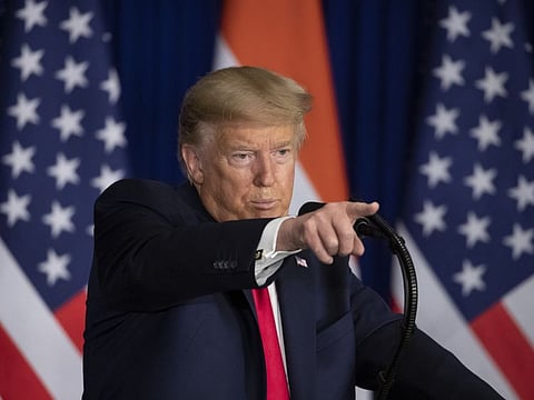 US President Donald Trump points to a question during a news conference on Tuesday in New Delhi.