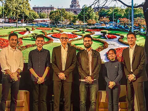Microsoft CEO Satya Nadella(3rd L) poses for a group photograph along with students during the Young Innovators Summit, in New Delhi, Wednesday, Feb. 26, 2020.