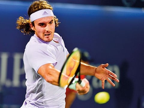 Stefanos Tsitsipas in action against Pablo Carreno Busta at the Dubai Duty Free Tennis Championships yesterday. Tsitsipas won in straight sets 7-6 (1), 6-1. 