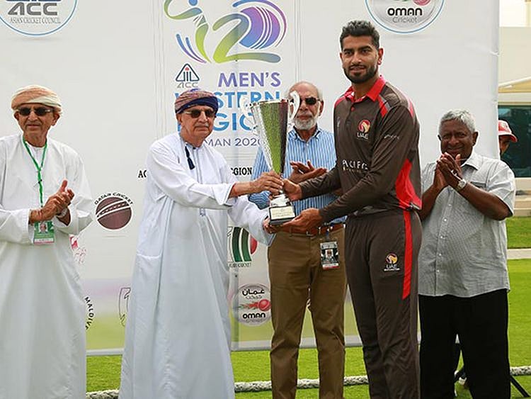 UAE captain Ahmad Raza received the Asian Cricket Council Western Region T20 tournament trophy from Kanak Khimji, Chairman of Oman Cricket and Sultan Rana, ACC’s Events and Development Manager. Picture: ACC
