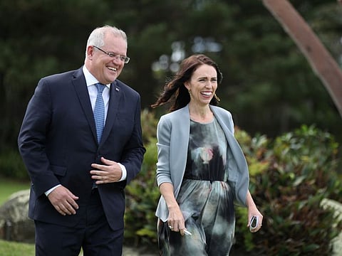 New Zealand Prime Minister Jacinda Ardern and Australian Prime Minister Scott Morrison arrive together for a joint press conference at Admiralty House in Sydney, Australia, on Friday.