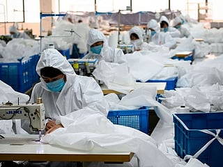 Coronavirus in China: Coat maker now makes hazmat suits