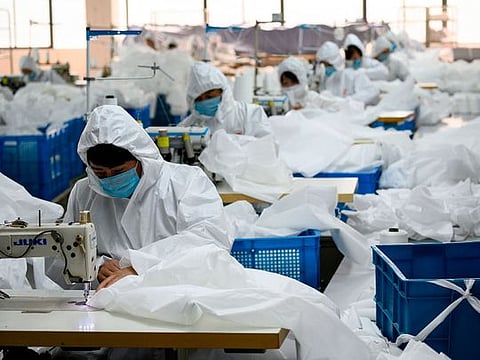 Coronavirus in China: Coat maker now makes hazmat suits