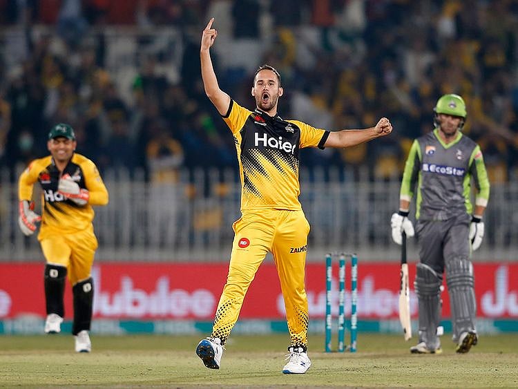 Peshawar Zalmi pacer Lewis Gregory, center, reacts after taking the wicket of Lahore Qalandars batsman Chris Lynn, right, during their Pakistan Super League T20 cricket match at Rawalpindi stadium in Rawalpindi, Pakistan, Friday, Feb. 28, 2020. (AP Photo/Anjum Naveed)