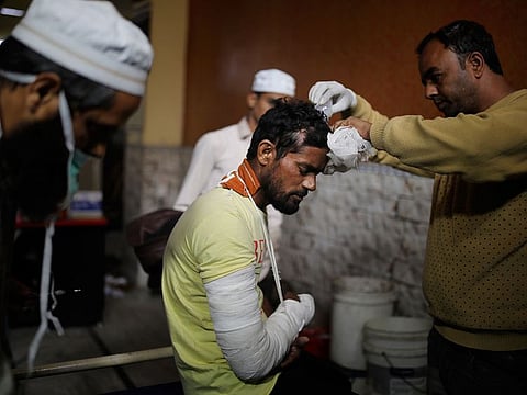 In this February 28 photo, paramedics attend to the wounds of Mohammad Illyas at Al Hind hospital in Old Mustafabad neighbourhood of New Delhi. The hospital in the riot-torn neighbourhood turned from a community clinic into a trauma ward, its doctors, for the first time, dealing with injuries like gunshot wounds, crushed skulls and torn male genitals.
