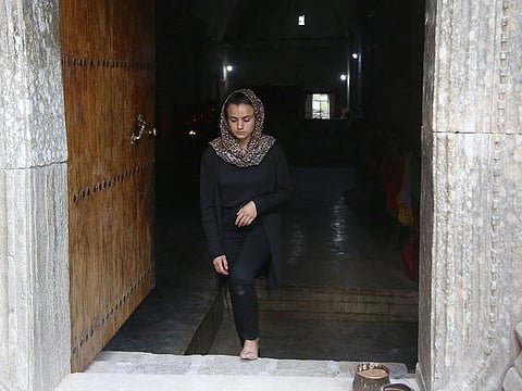 Ashwaq Haji Hamid Talo visiting a temple near Sinjar in 2018 to pay tribute to ISIS victims from her village.