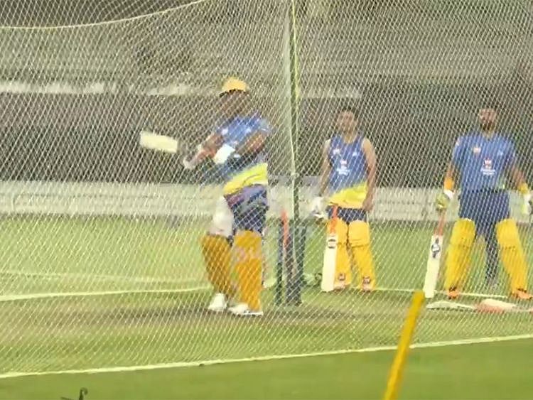 Chennai's MS Dhoni watches his shot sail for a six during a nets session