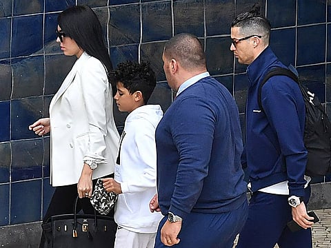 Juventus' Portuguese forward Cristiano Ronaldo, his partner Georgina Rodriguezand his son Cristiano Jr arrive at Madeira airport in Funchal