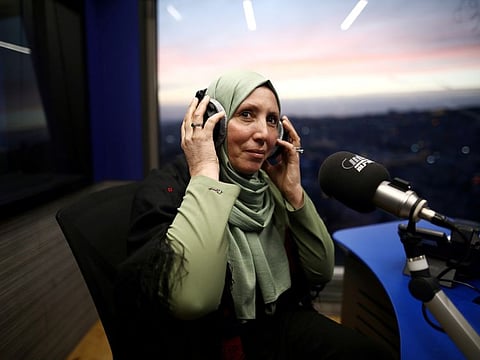 Iman Yassin Khatib, poised to become the first lawmaker in Israel's history to wear a hijab or head scarf, following results of her Arab Joint List party in Israel's election, participates in an interview in a radio show in Nazareth, Israel.