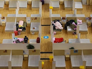 Empty beds at Wuhan hospitals amid signs of hope in fight against coronavirus