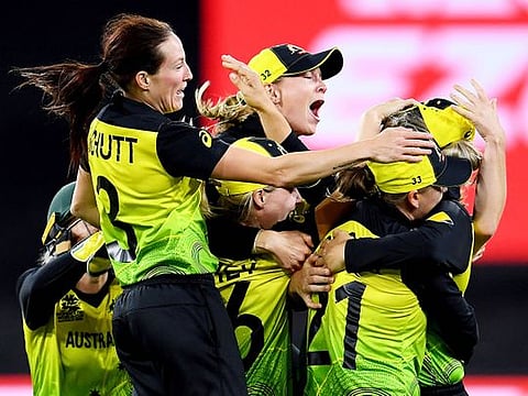 Australia's players celebrate after winning against India in the Twenty20 women's World Cup cricket final in Melbourne. 