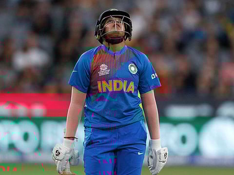 A crestfallen Shafali Verma walks away after losing her wicket to Australia's Megan Schutt during the Women's T20 World Cup final match in Melbourne on Sunday. India lost the final by 85 runs.