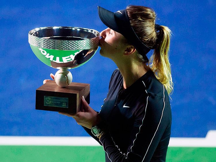TOPSHOT - Ukraine's tennis player Elina Svitolina kisses the trophy after winning the Monterrey WTA Open women's final singles tennis match against Czech Republic's Marie Bouzkova, in Monterrey, Nuevo Leon State, Mexico on March 8, 2020.  / AFP / Julio Cesar AGUILAR