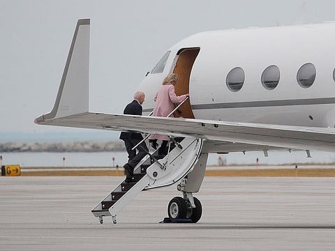 Democratic U.S. presidential candidate and former Vice President Joe Biden reboards his campaign plane with his wife Jill shortly after landing in Cleveland to depart after cancelling a primary night rally over coronavirus concerns in Cleveland, Ohio, U.S., March 10, 2020.