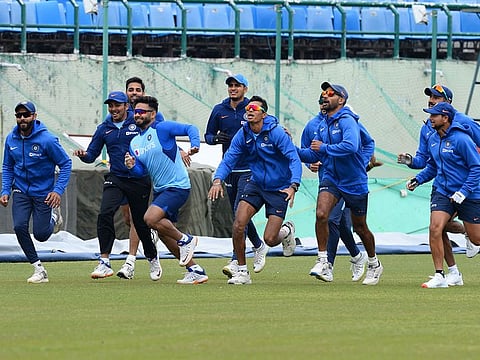 Indian cricketers run during a practice session ahead of first ODI against South Africa, at the Himachal Pradesh Cricket Association Stadium in Dharamsala on March 11, 2020. 