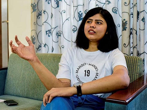Shreya Siddanagowder gestures as she talks during an interview with AFP at her home in Pune, more than two years after transplant surgery for both hands. 