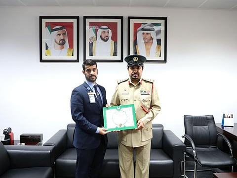 Sergeant Mohammad Khalid being honoured for his rescue effort