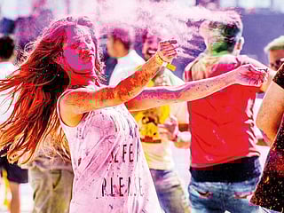 Indian revelers celebrate Holi with huge splash of colours