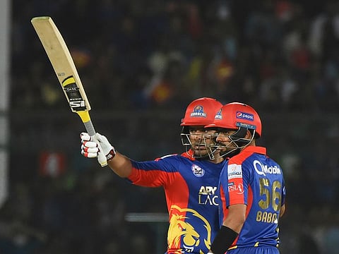 Sharjeel Khan of Karachi Kings acknowledges his fifty with partner Babar Azam 