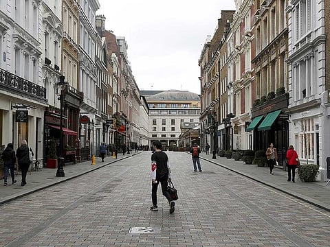 A sparsely populated street is seen near Covent Garden in London on March 13, 2020.