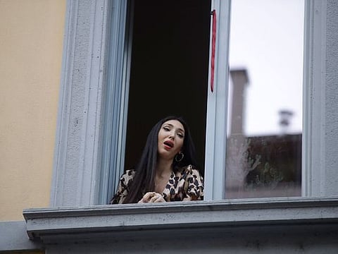 Italians sing out from balconies during coronavirus lockdown 