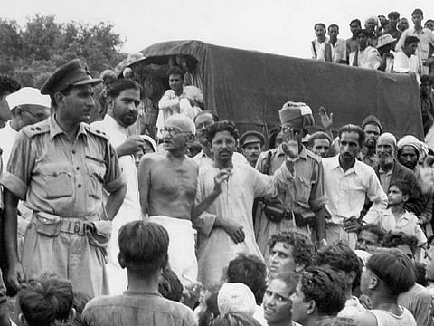 Mahatma Gandhi (centre) visits Muslim refugees at Purana Qila in New Delhi on September 22, 1947, as they prepare to depart to Pakistan a month after the signing of India and Pakistan's Independence from British rule on August 14-15, 1947. 