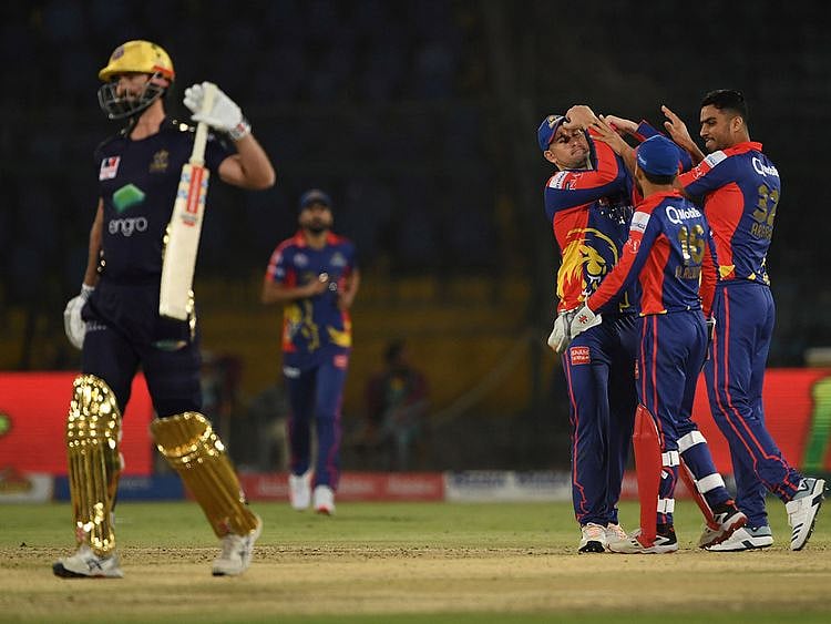 Karachi King's Arshad Iqbal (R) celebrates the wicket of Quetta Gladiators Ben Cutting