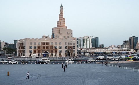 This picture taken on March 16 shows a view of the almost deserted Souq Waqi in Qatar's capital Doha, with the spiral minaret of the mosque at the Abdulla Bin Zaid Al Mahmoud Islamic Cultural Centre seen in the background. 