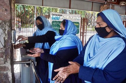  Security guards wash hands as safety precautions to keep themselves safe from coronavirus. 
