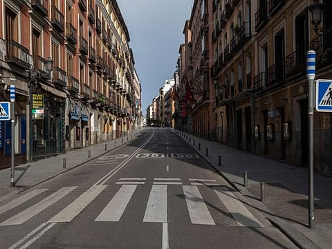 Streets across several cities turn eerily quiet following coronavirus lockdown. The usually busy streets in Madrid, above, wore a deserted look 