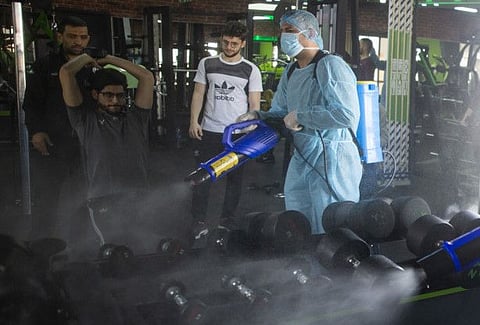 A Palestinian Health worker sprays disinfectant as a precaution against the coronavirus in a gymnasium in Gaza City on March 15.