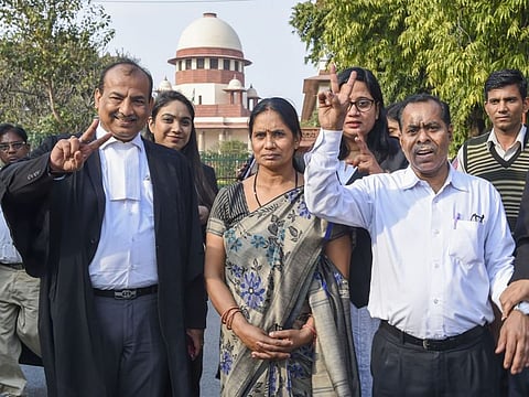 Nirbhaya's parents along with Advocate Jitendra Kumar Jha leave the Supreme Court, in New Delhi, on March 5, 2020.