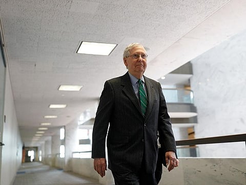 Senate Majority Leader Mitch McConnell (R-KY) walks down a hallway ahead of a Senate luncheon meeting on response to the coronavirus disease (COVID-19) outbreak in Washington, U.S., March 19, 2020. 
