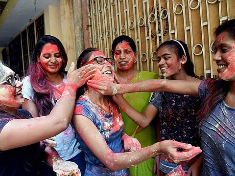 Girls celebrate after the hanging of Nirbhaya convicts, in Patna on Friday.