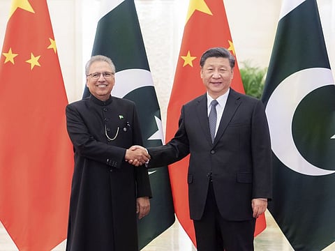 Beijing: In this March 17, 2020 photo released by China's Xinhua News Agency, Chinese President Xi Jinping, right, shakes hands with Pakistan's President Arif Alvi before a meeting at the Great Hall of the People in Beijing. AP/PTI(AP18-03-2020_000005B)