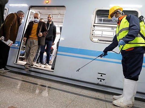 A member of medical team sprays disinfectant as a precautionary move amid concerns over the coronavirus disease (COVID-19) outbreak in Cairo, Egypt (File)