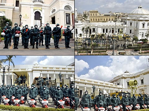 A combo image released by the army showing military specialised units in protective gear sterilising the Egyptian parliament in Cairo.